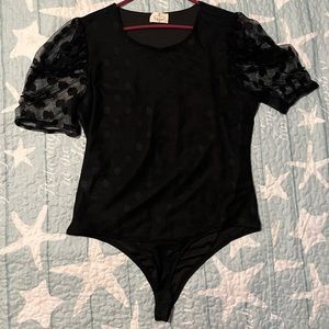 Assorted color. Button snap bodysuits.